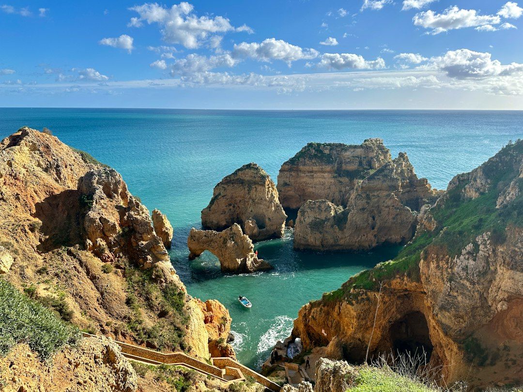 Praia da Coelha cove cut into ochre cliffs, Albufeira