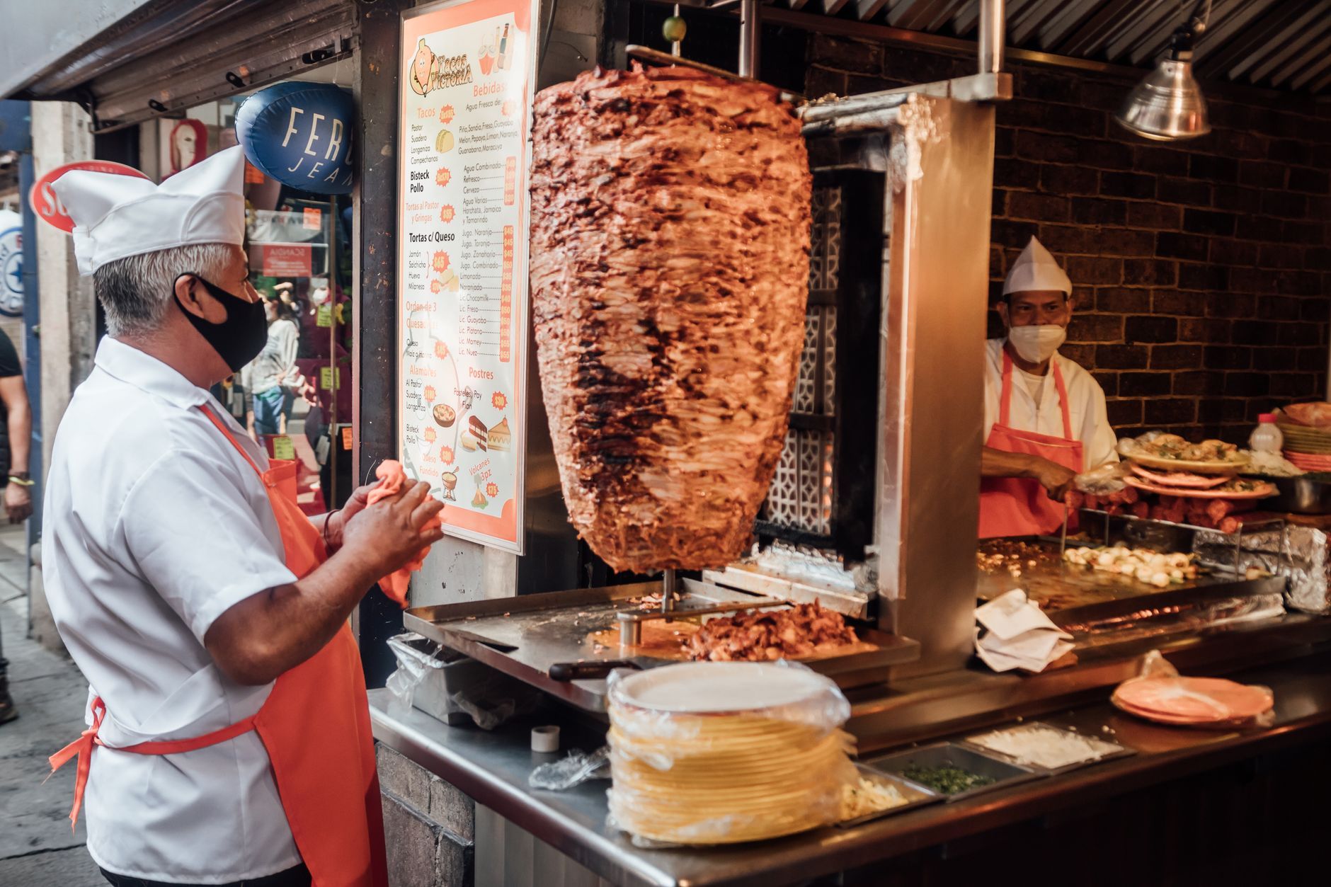 Tacos al pastor sliced from the trompo spit